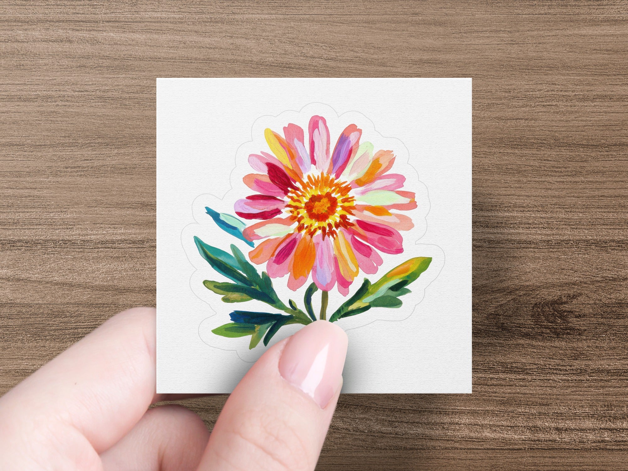 Watercolor floral sticker with pink, orange, and yellow petals on a white background.