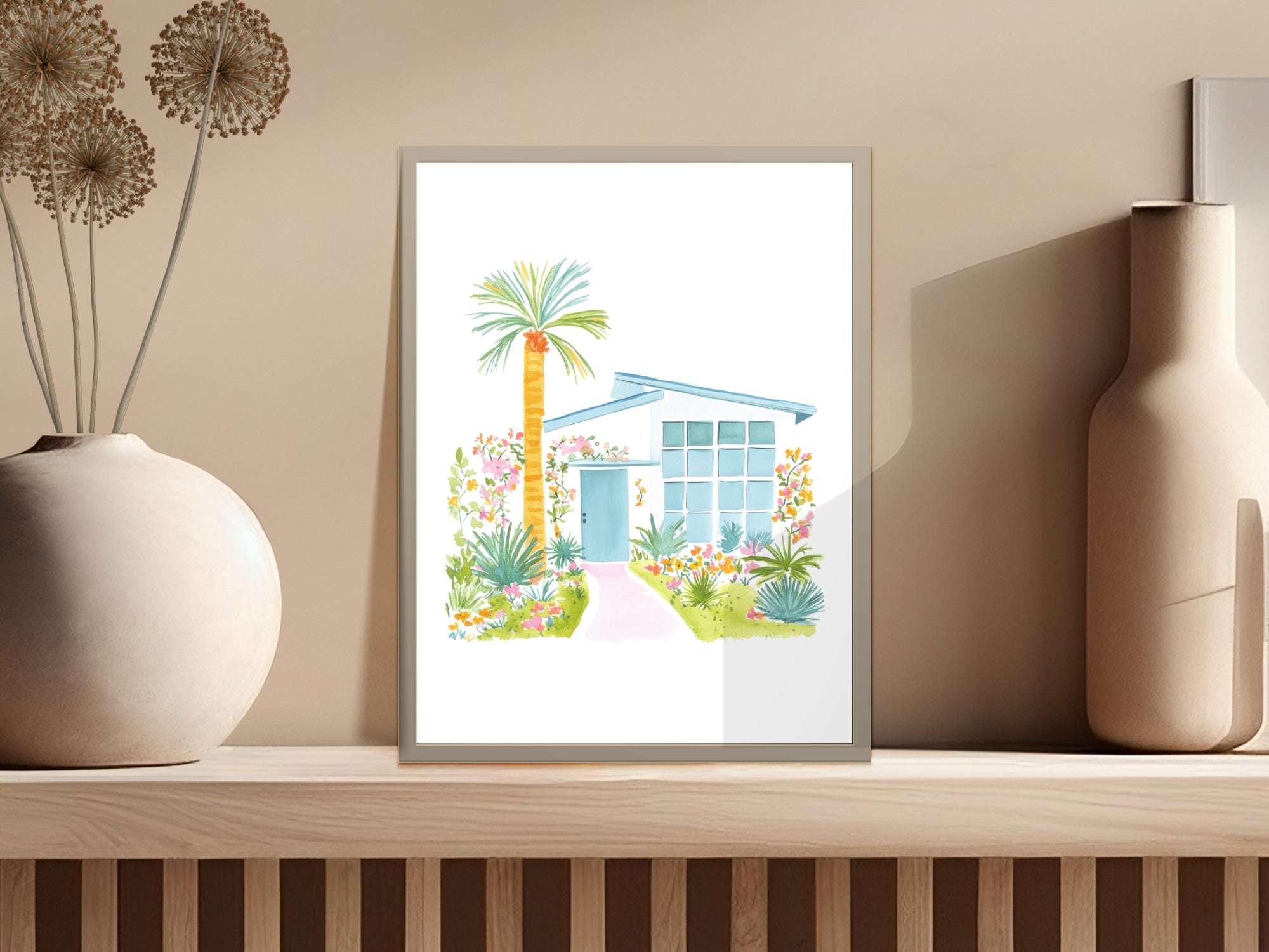 Watercolor illustration of a mid-century modern home with palm tree and flowers.