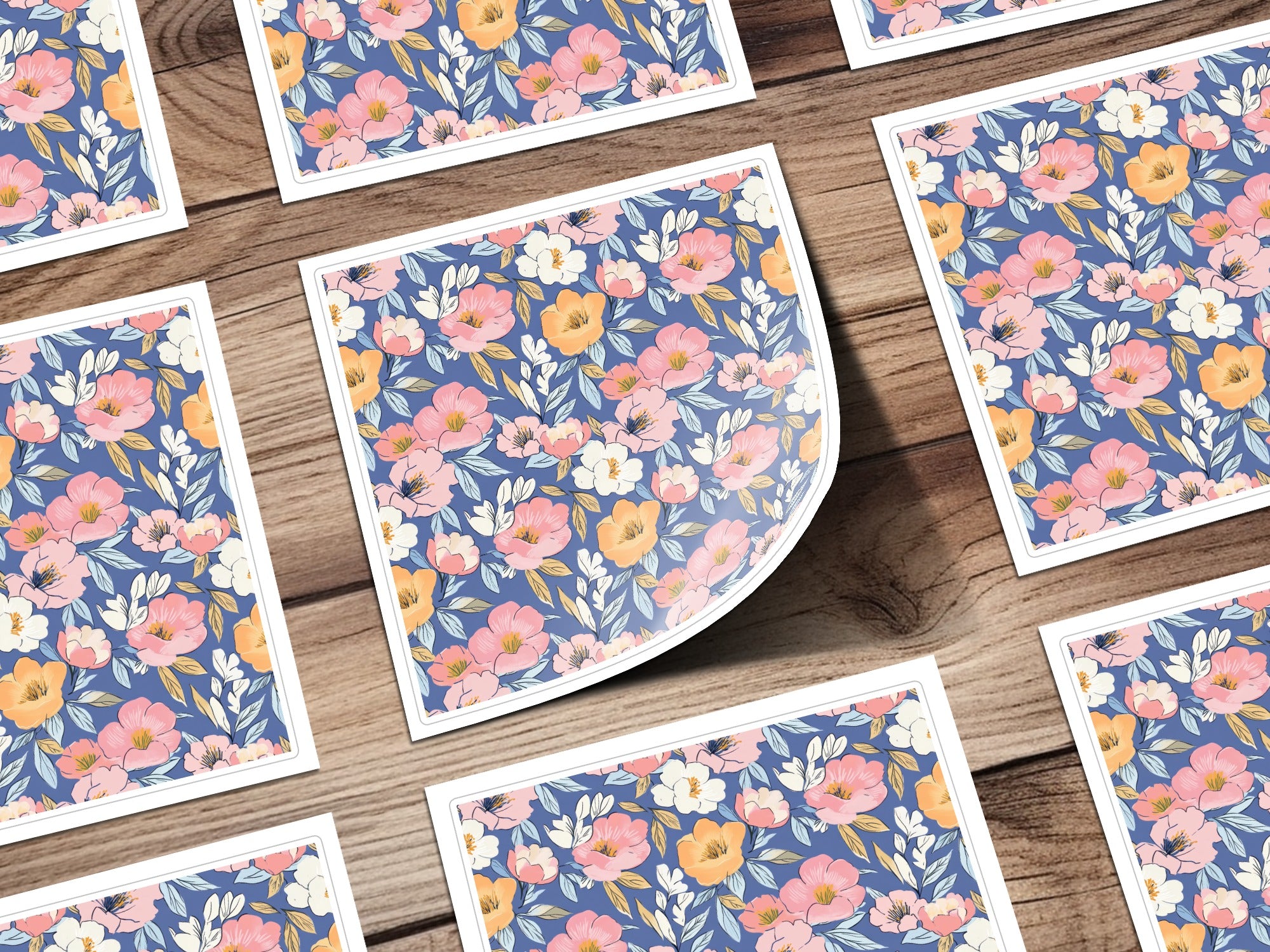 Square cards with a floral pattern featuring pink and orange flowers and blue leaves.