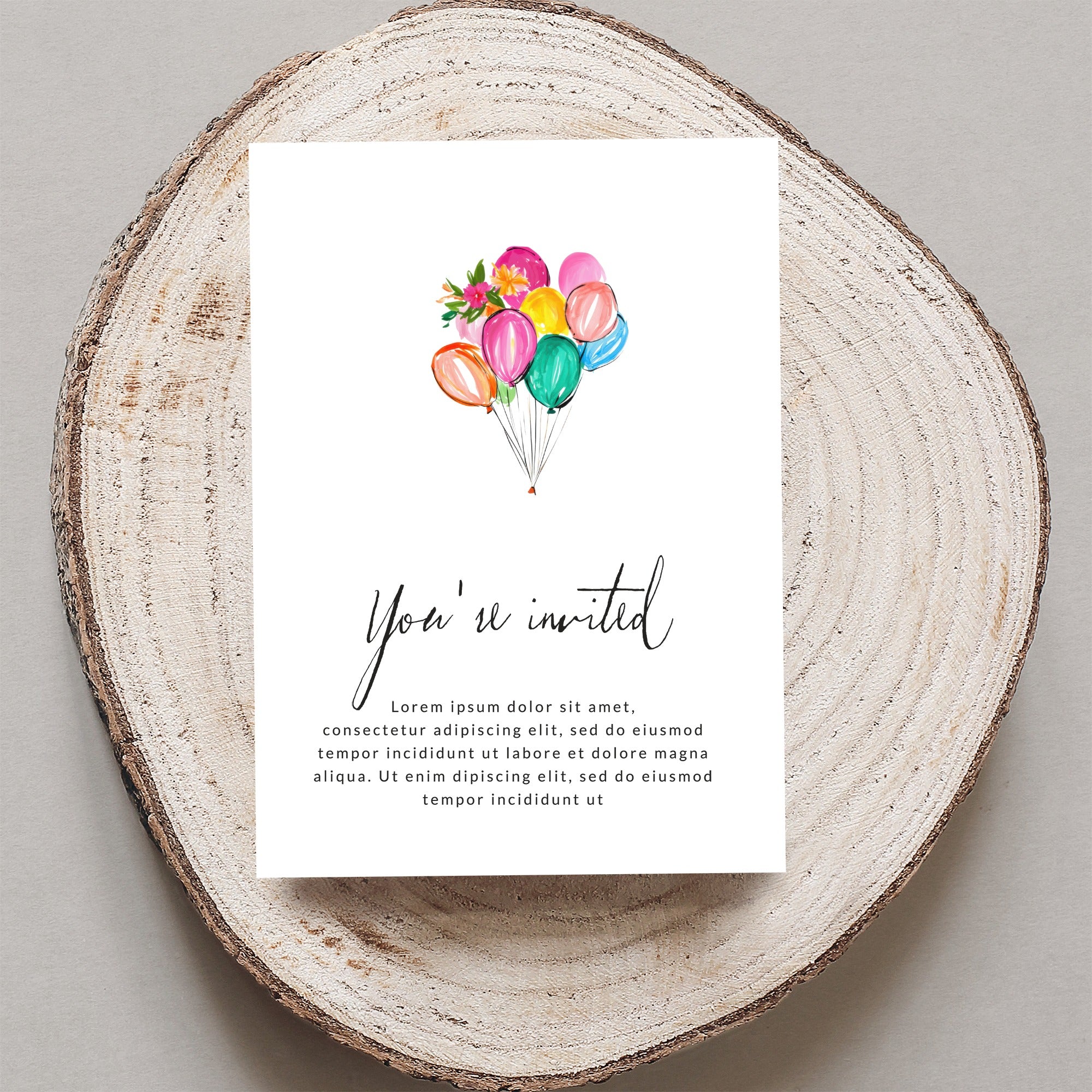 Invitation with colorful balloons and "You're invited" text.