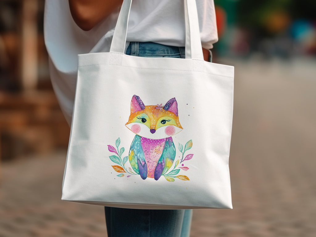 White tote bag with a colorful, watercolor fox illustration and leaves.