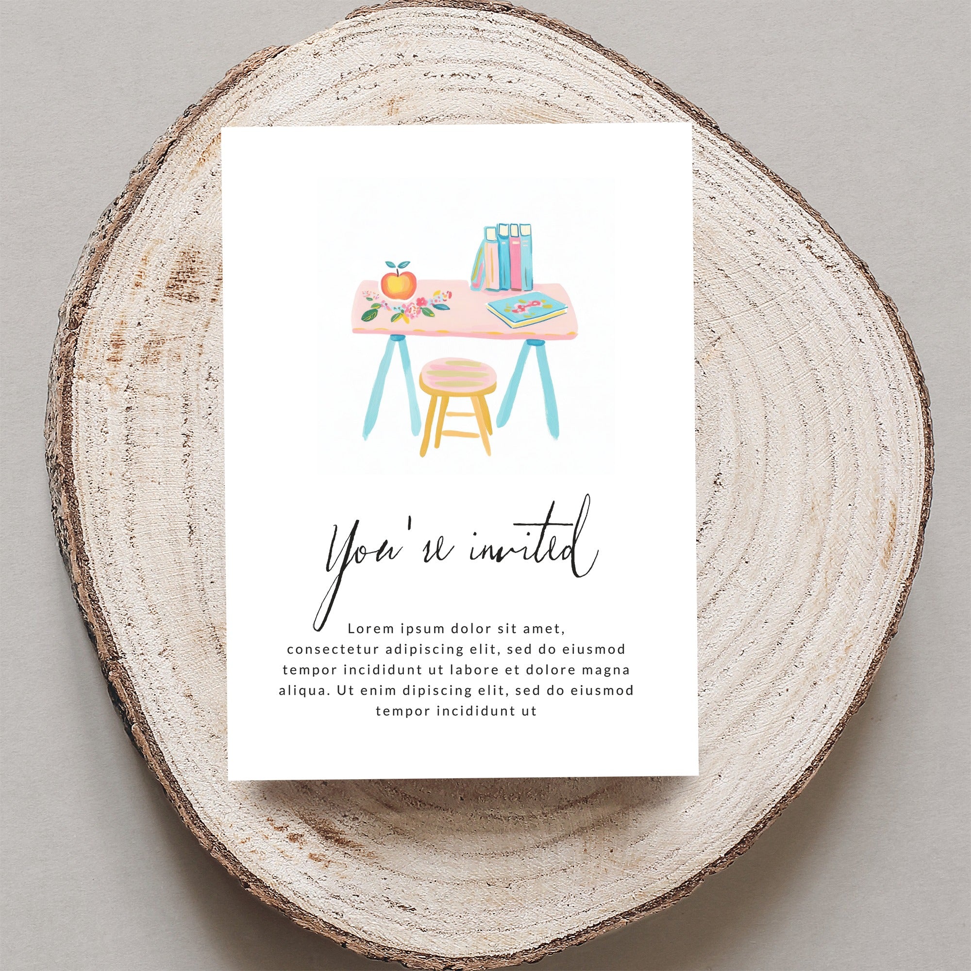 Invitation with watercolor desk scene and "You're invited" text.