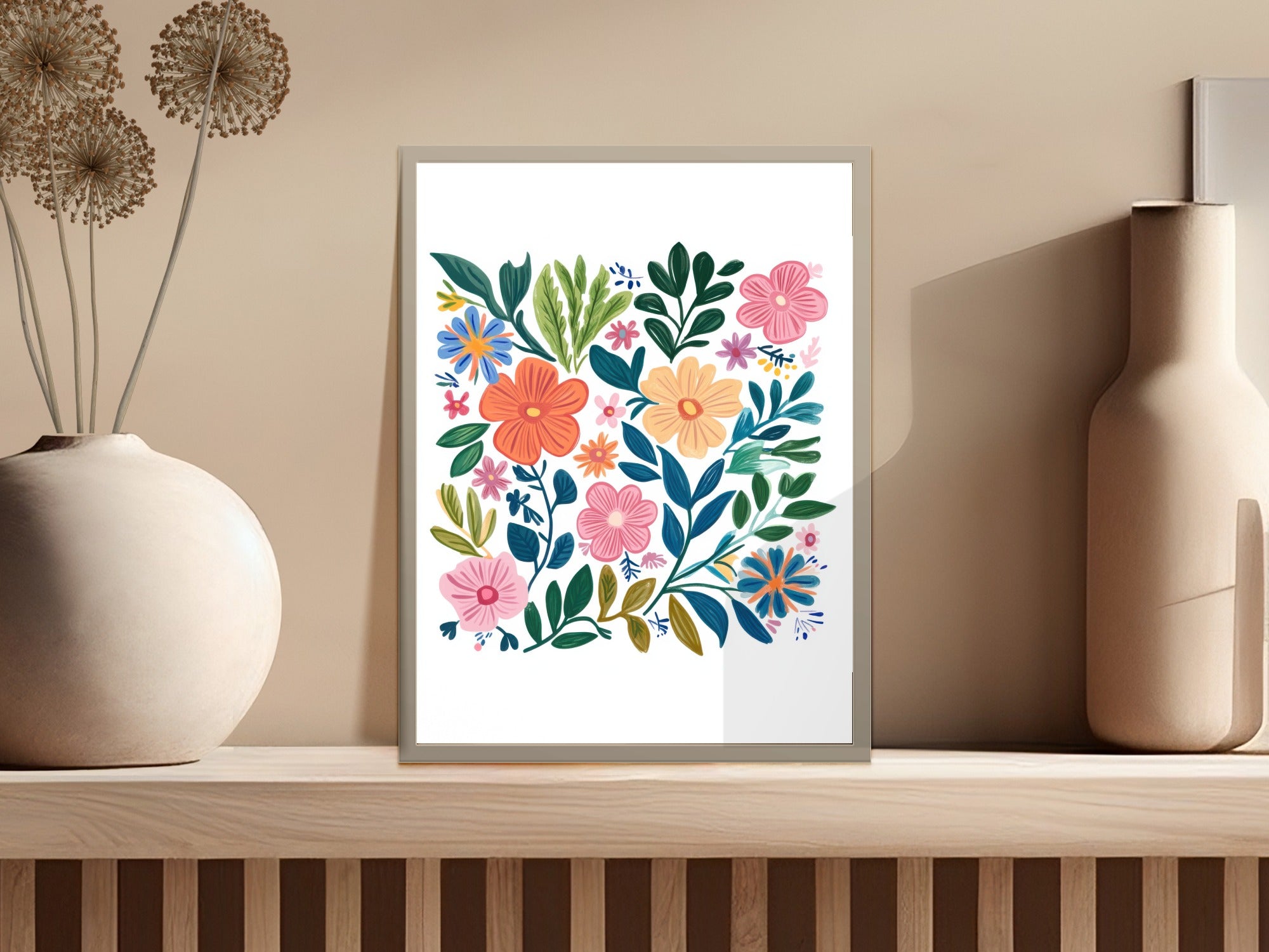Framed colorful folk art floral print with coral, pink, and blue flowers.