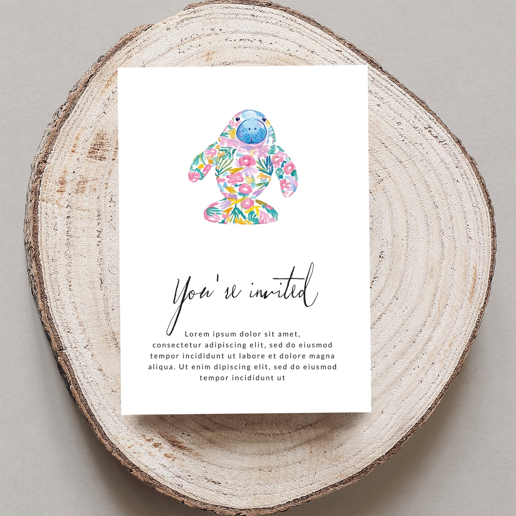 Invitation with floral manatee illustration and placeholder text.