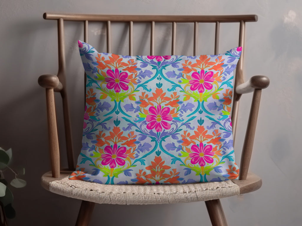 Decorative throw pillow with a vibrant floral pattern on a wooden chair.