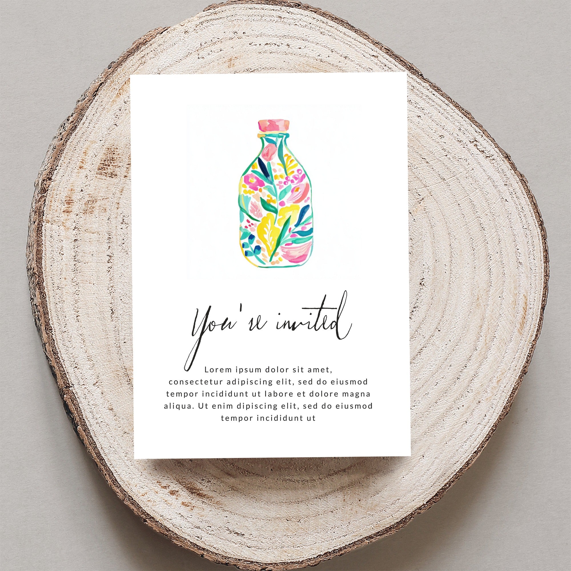 Invitation with floral bottle graphic and "You're invited" text.