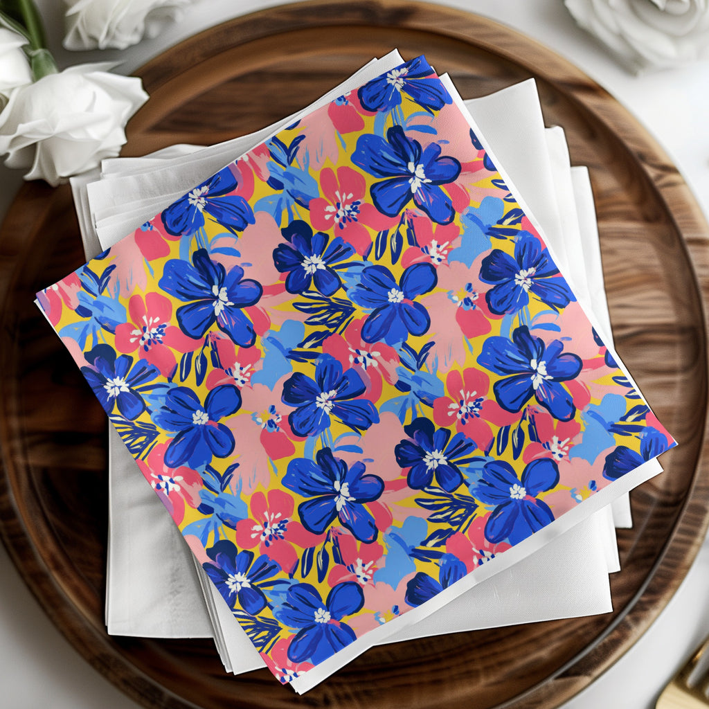 Colorful floral pattern napkins stacked on a wooden tray.