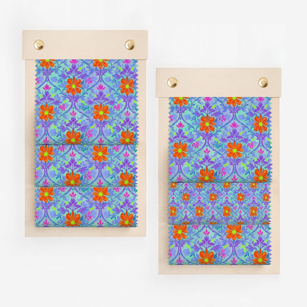 Fabric swatches with purple, orange, and blue floral pattern on light wood backing.