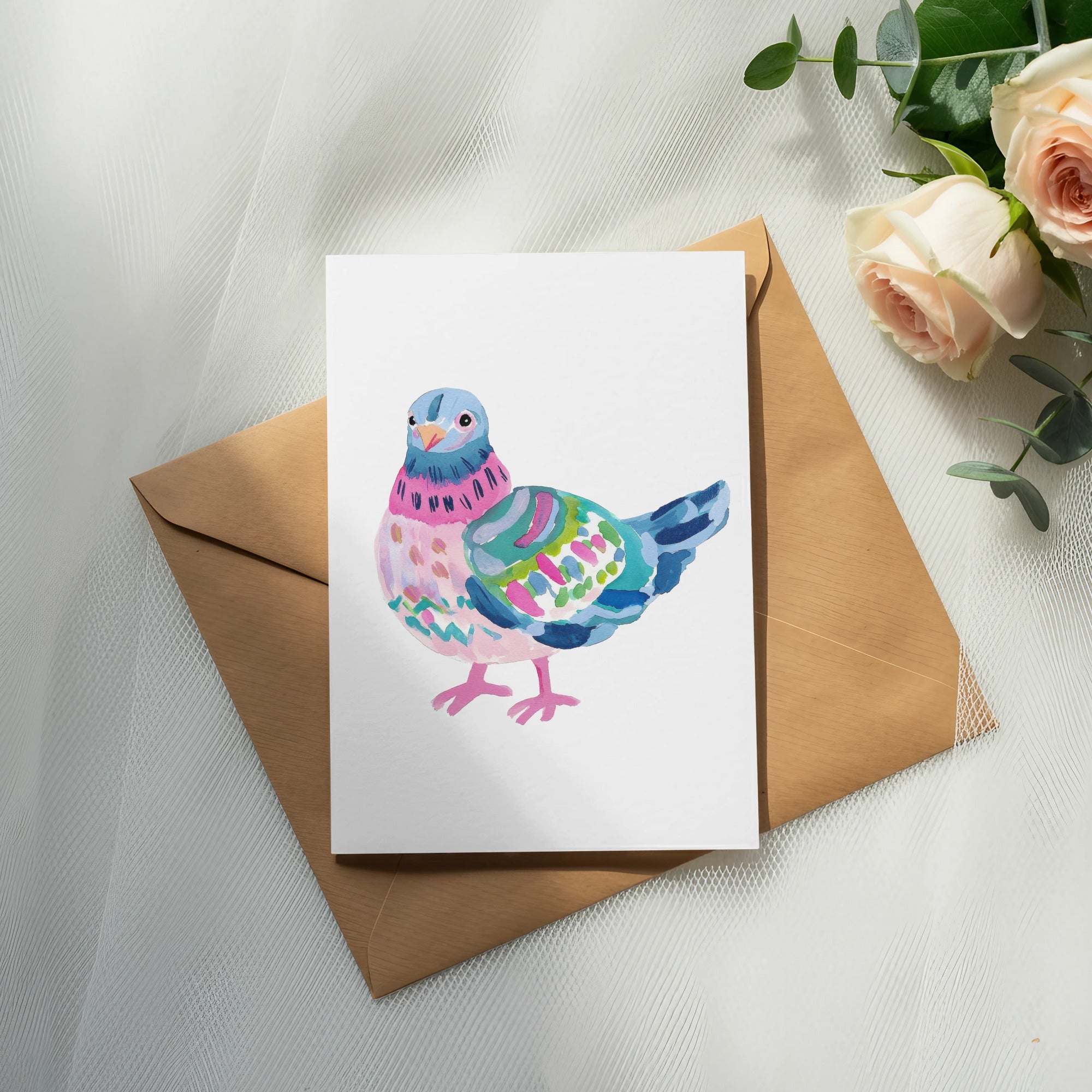 Watercolor painting of a colorful bird on a card with a brown envelope.
