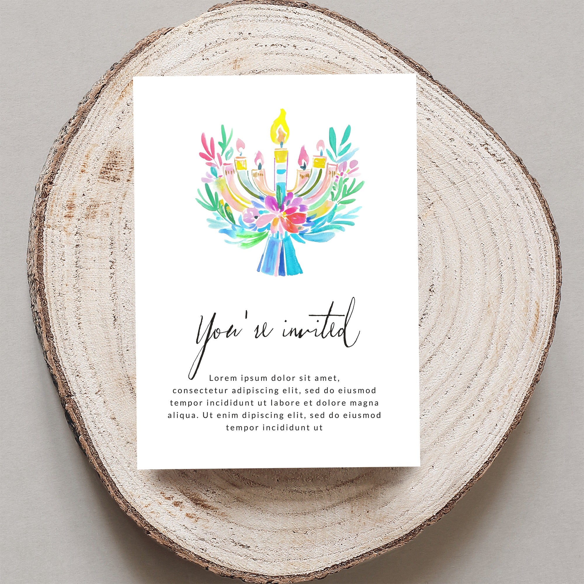 Invitation with watercolor menorah and "You're invited" text.