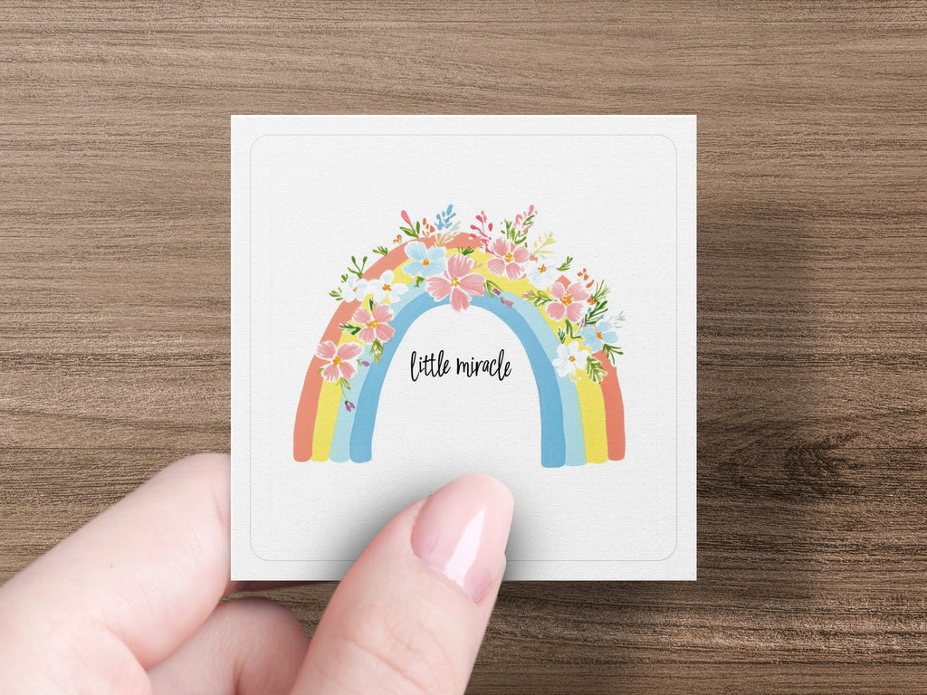 Square card with rainbow and floral design, text "little miracle".