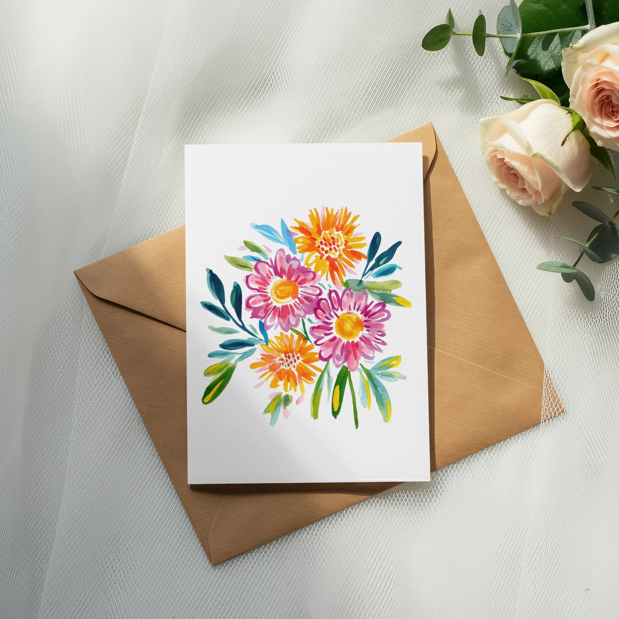 Watercolor bouquet of pink and orange flowers on a card over a brown envelope.
