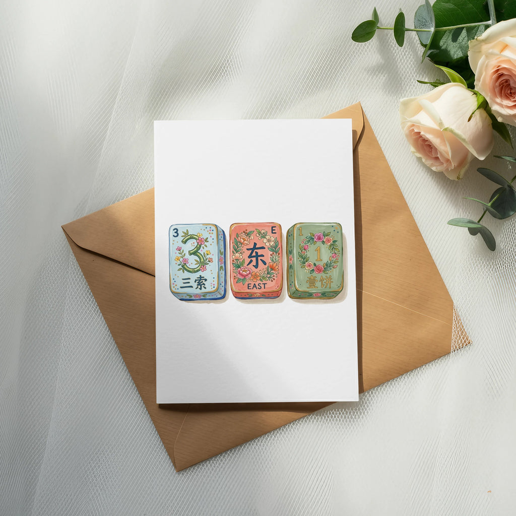 Mahjong tiles 'three of characters', 'east', and 'one of characters' on a card.