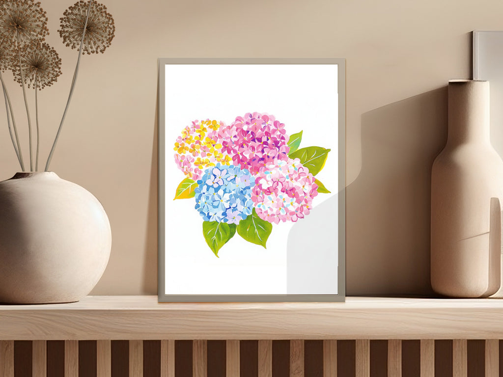Watercolor painting of pink, blue, and yellow hydrangeas in a framed artwork.