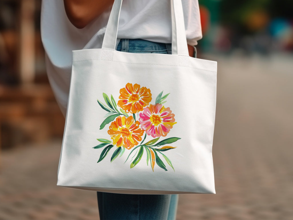 White tote bag with watercolor marigold flowers and green leaves design.
