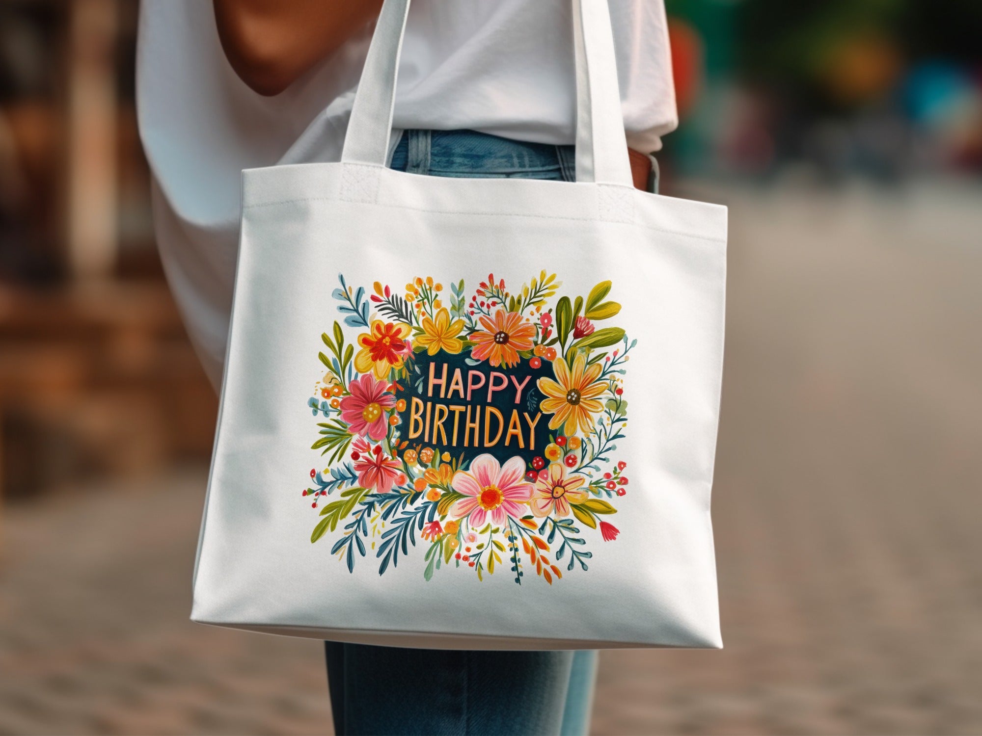 White tote bag with "Happy Birthday" text surrounded by colorful floral design.