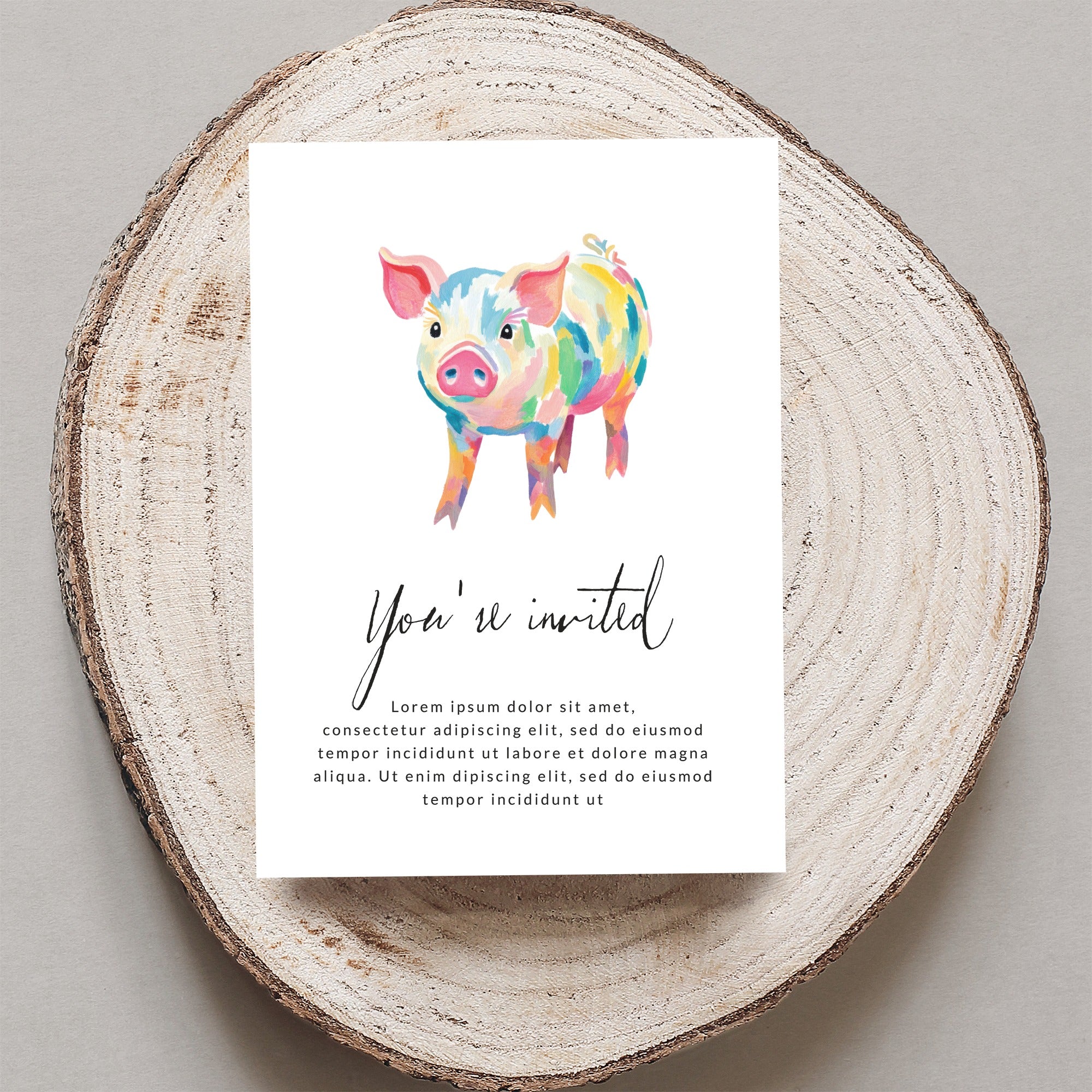 Watercolor pig illustration on an invitation card.