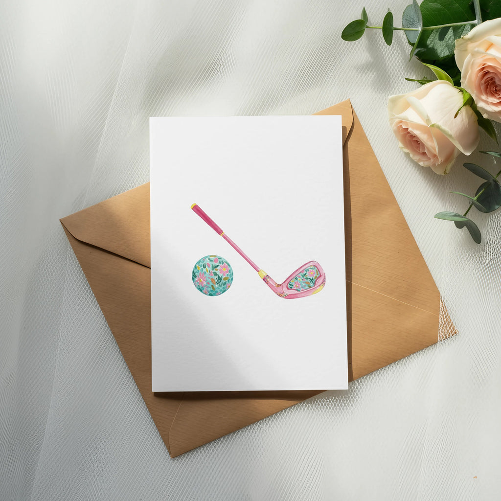 Pink floral golf club and ball on card over envelope with roses.