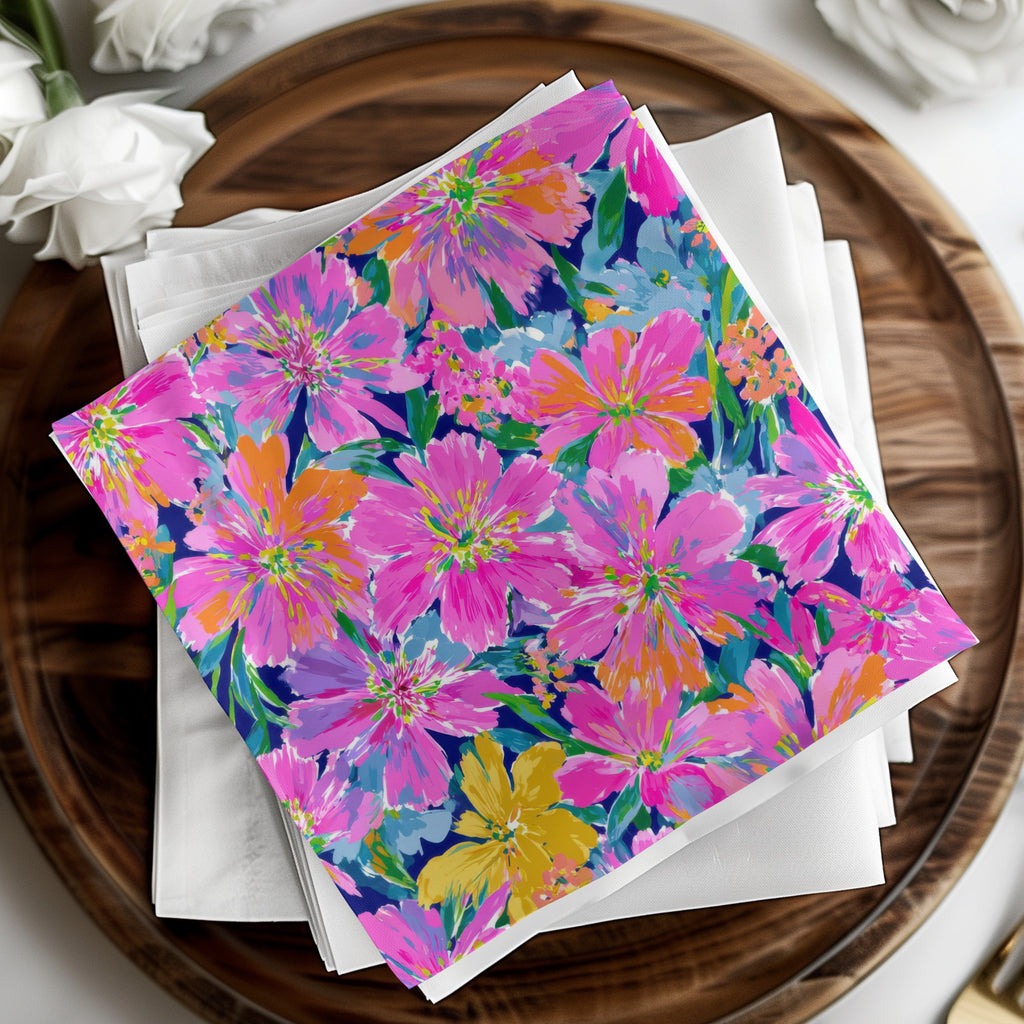 Floral patterned napkins on a wooden tray with white napkins.