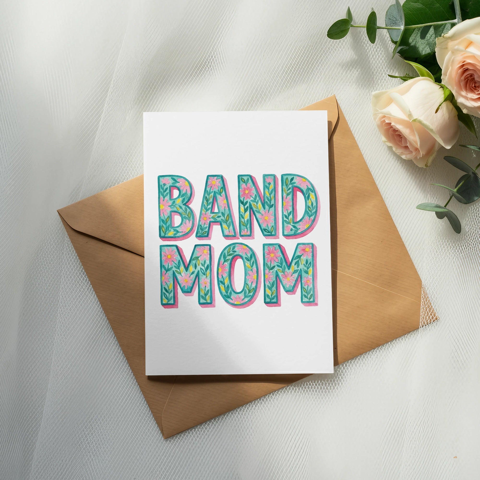 Card with "BAND MOM" in floral letters on envelope