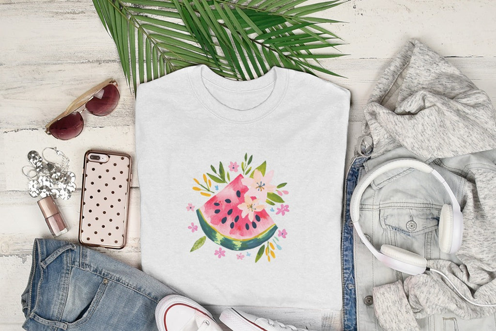 White t-shirt with a watermelon slice and floral graphic, styled with clothing and accessories.