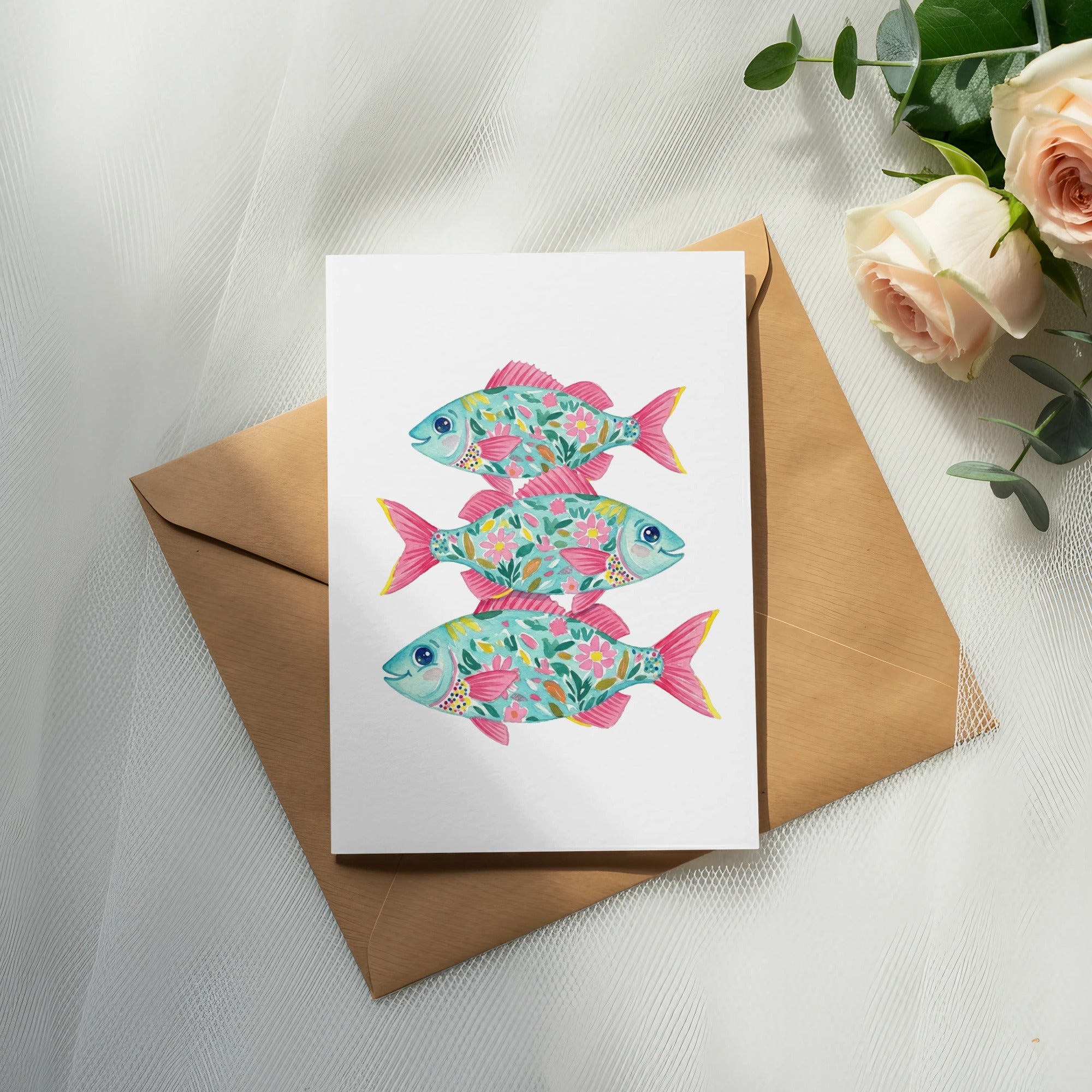 Card featuring three decorative, floral-patterned fish stacked vertically.