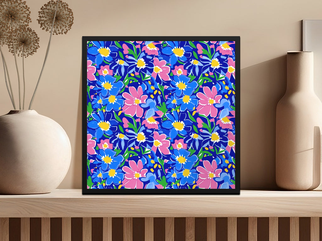 Framed floral art with blue and pink flowers on a dark blue background.