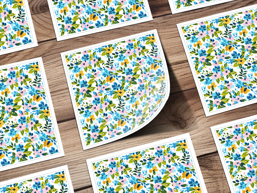 Floral pattern on square cards with a wooden background.