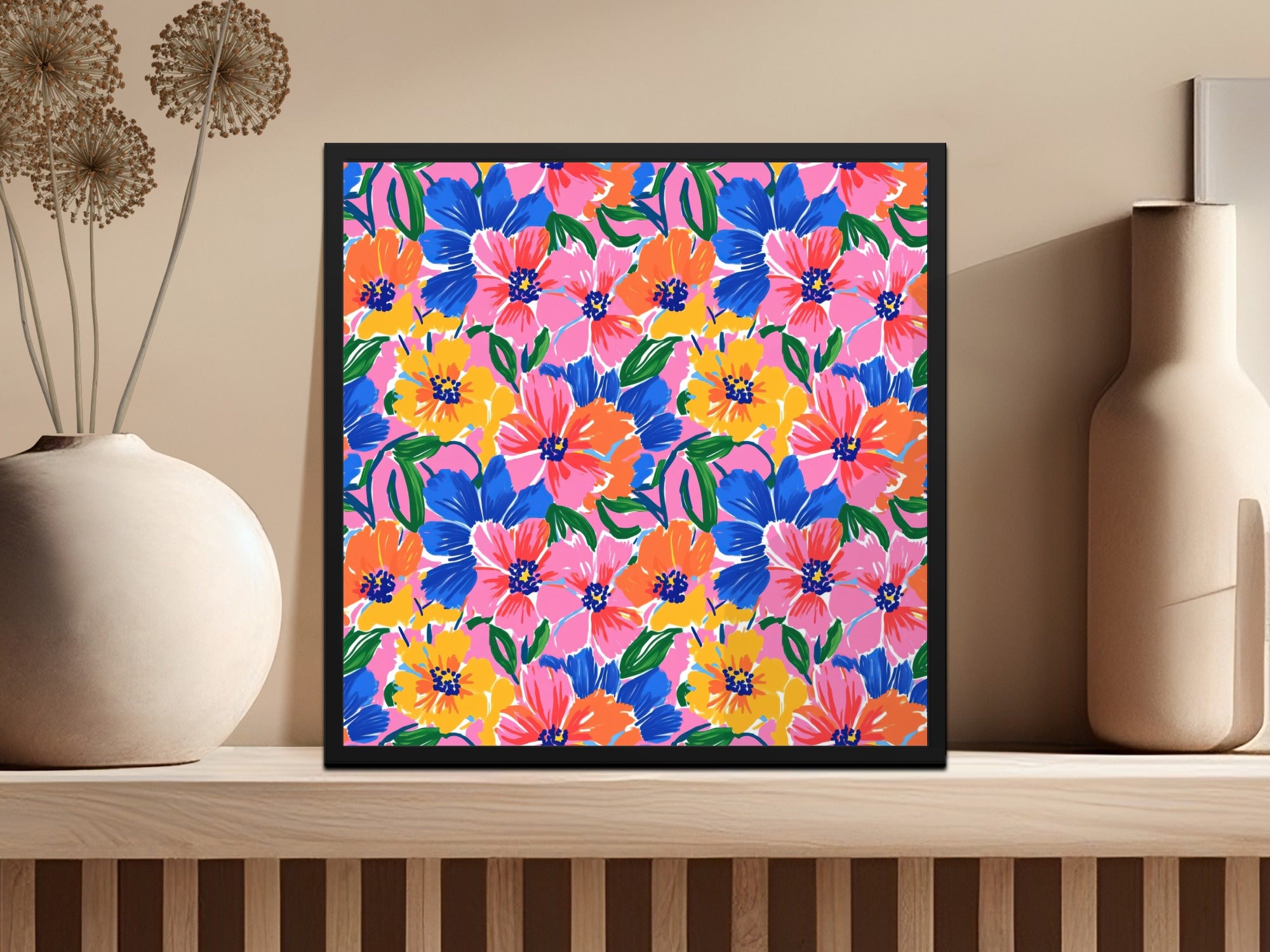 Floral art print with pink, blue, and yellow flowers in a black frame.