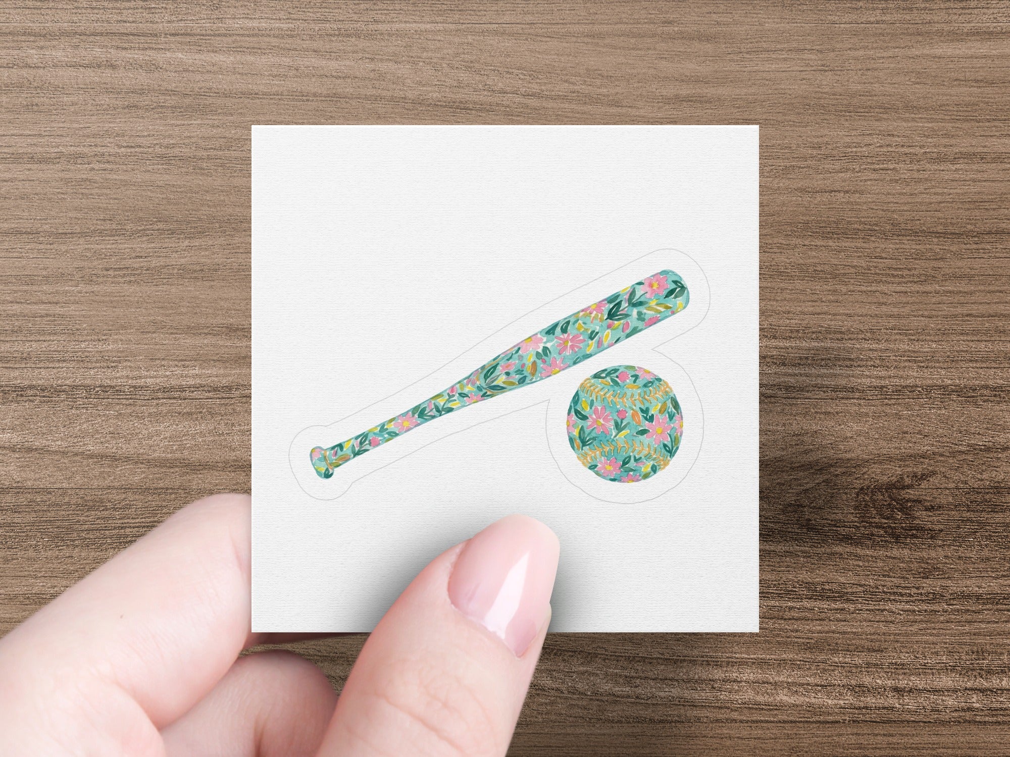 Baseball bat and ball with floral pattern.
