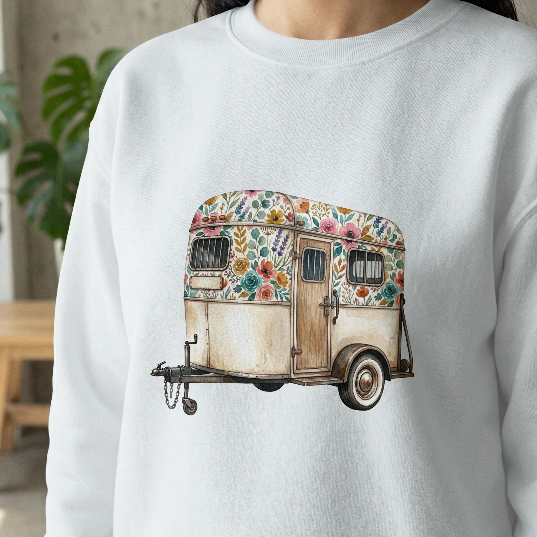 White sweatshirt with watercolor floral trailer illustration.