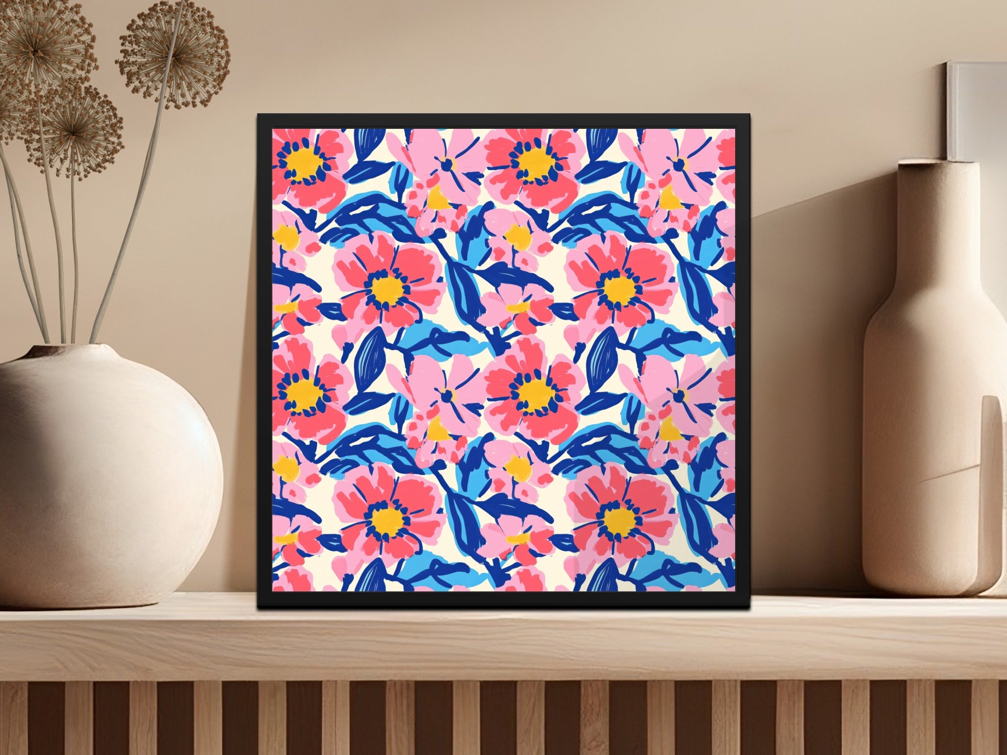 Framed floral art with pink and blue flowers on a cream background.