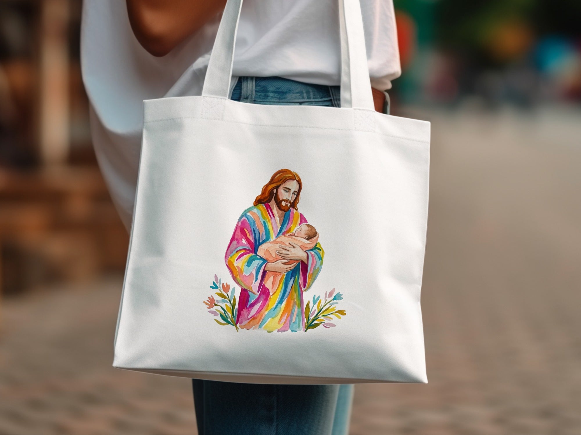 Jesus holding a baby, surrounded by colorful flowers and leaves.