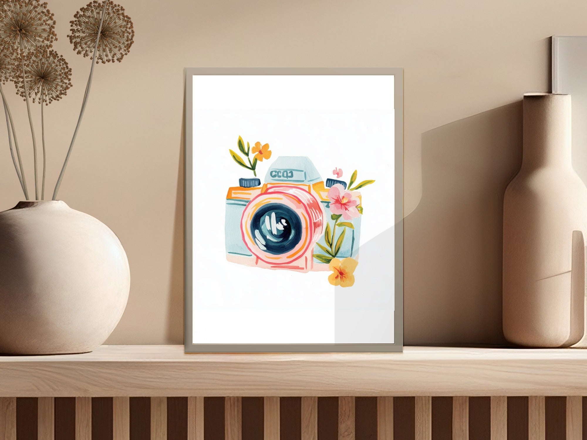 Watercolor illustration of a vintage camera with flowers.