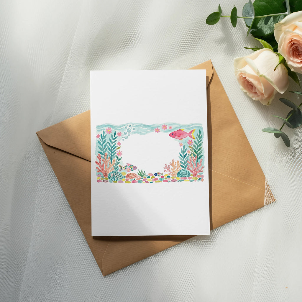 Card with watercolor illustration of fish and coral on a brown envelope.