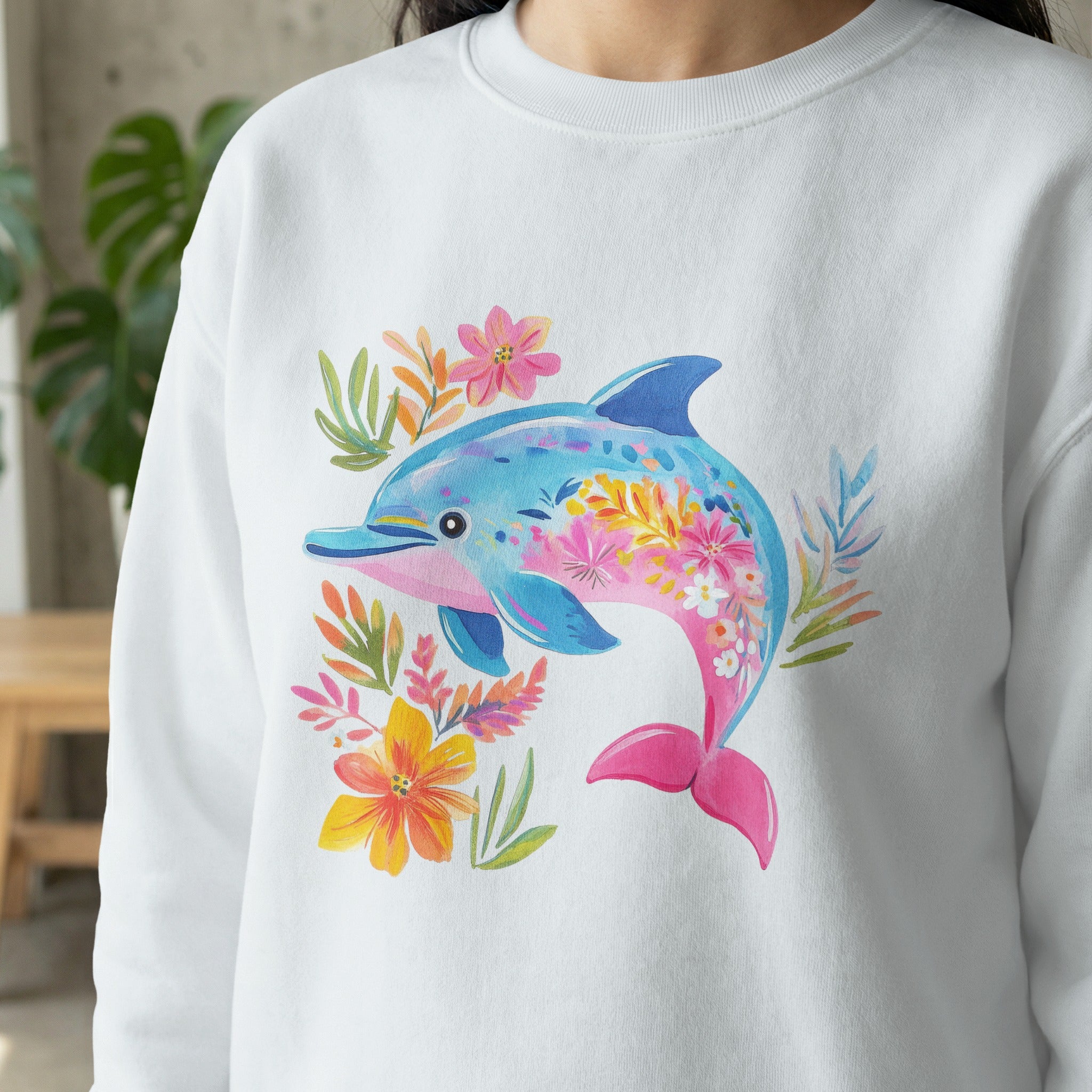 White sweatshirt with a colorful floral dolphin design.