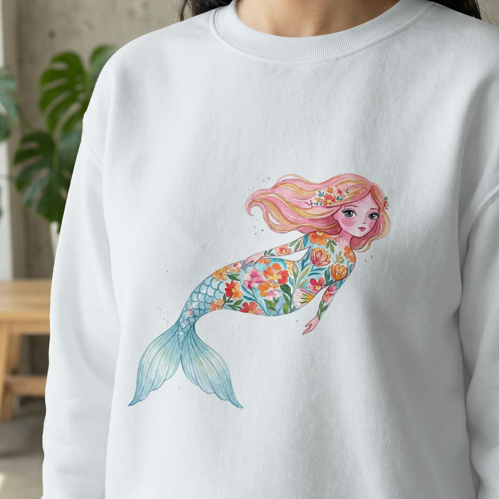 White sweatshirt featuring a watercolor mermaid with floral patterns.