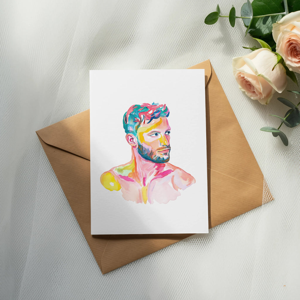 Watercolor painting of a man with colorful hair on a card atop an envelope.