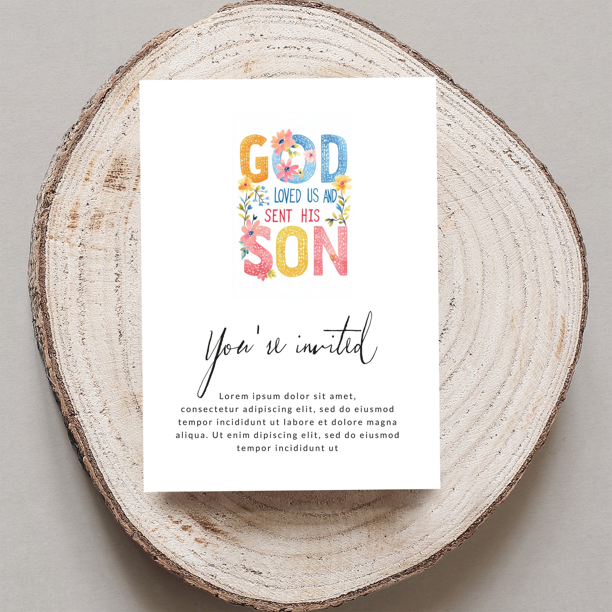 Invitation card with "God Loved Us And Sent His Son" text and floral accents.