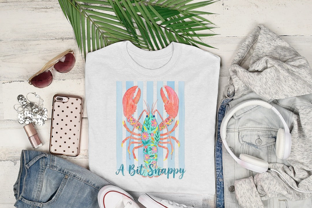 White t-shirt with blue stripes and a colorful lobster graphic.