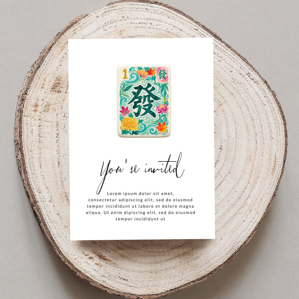 Mahjong tile invitation with floral accents and "You're invited" text.