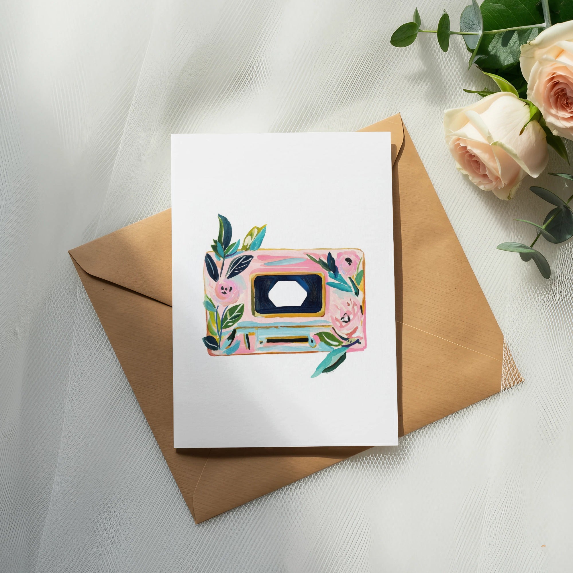 Card with floral cassette tape design on a kraft envelope.