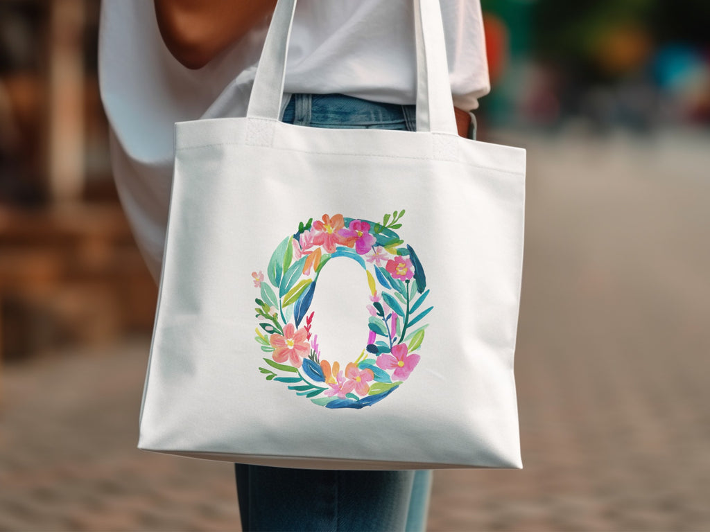 White tote bag with floral letter O design.