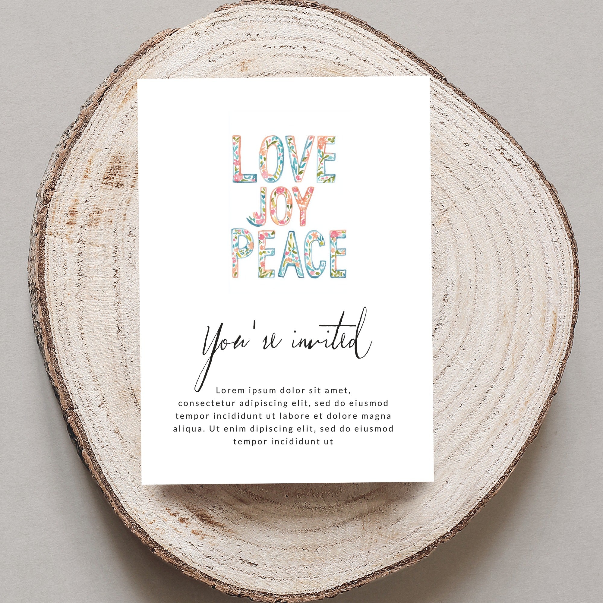 Card with "LOVE JOY PEACE" in colorful letters, inviting guests.