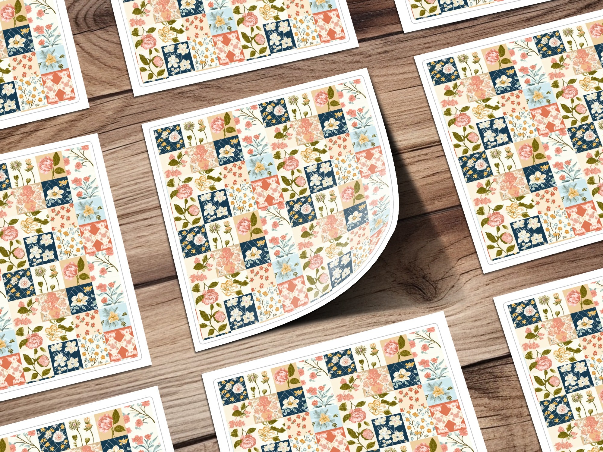 Floral patchwork squares on a wooden background, some tilted.