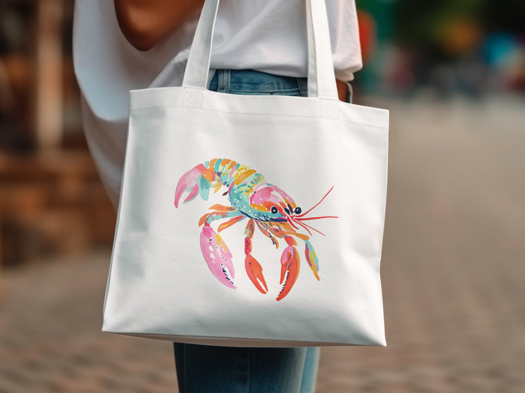 White tote bag with a colorful watercolor lobster graphic.