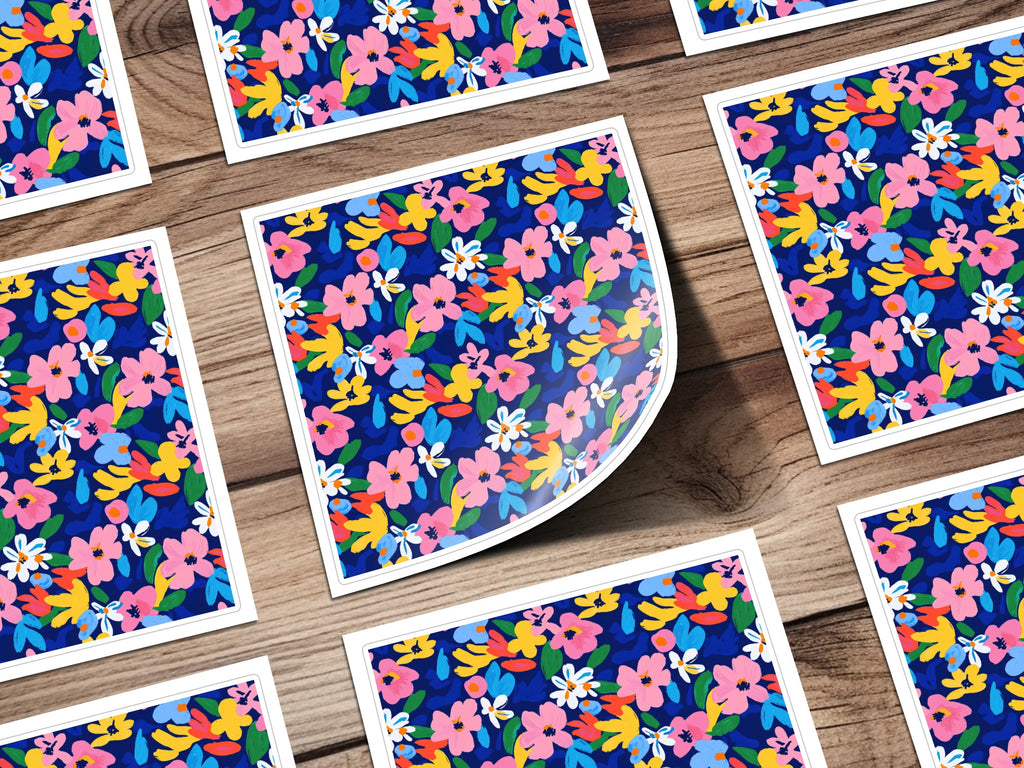 Scattered floral pattern cards on a wooden background.