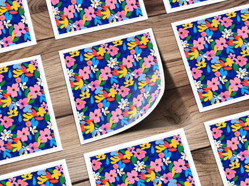 Scattered floral pattern cards on a wooden background.