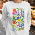 White sweatshirt with a colorful, dense floral pattern.