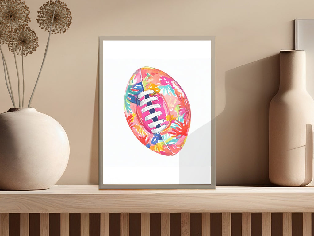 Colorful floral pattern on a rugby ball in a framed print.